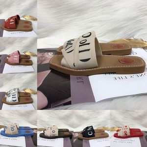 Sandali legnosi per donne da donna lettere in tessuto in tela muli bassi tacchi di moda da donna di lusso scarpe casual pantofole chioe legno scivolo femmina sandale