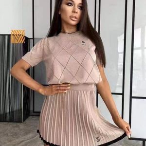 2024 summer new temperament mm letter pattern simple round neck waist short sleeve knitted dress designer female pleated skirt