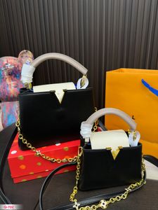 Lousis väskor designer handväska kvinnor axelpåsar handväska tillbehör crossbody väska mini baguette handväska slingväska präglad väska på väska vouton