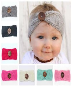 Nya babyflickor Fashion Wool virkning pannband stickat hårband med knappdekor Vinter nyfödd spädbarn öron varmare huvud headwrap 10 col7612863