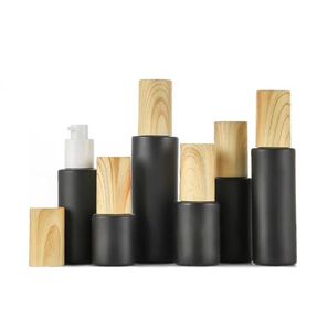 Empty glass pump bottles refillable black frosted glass lotion bottles essential oil spray bottle with woodgrain plastic cap 20ml 9395554