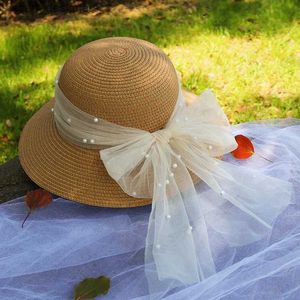 Cappelli larghi cappelli a secchio Cappelli da donna Cappello Summer Wide Brimmed Sun Hat Elegant Pearl Fairy Mesh Bow Ribbon Top Top Sun Hat Beach Hat Y240409