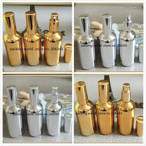 Lagringsflaskor 100 ml silver/guld eterisk oljeflaska med dimsprutning/lotionpumpsprutning/pump för kosmetisk L -förpackningsglas