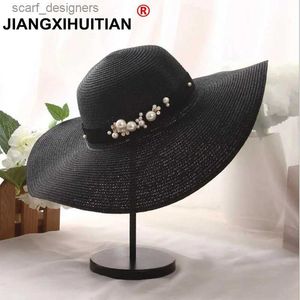 Szerokie brzegowe czapki wiadra czapki 2017 Summer Fash Flat Brim Straw Hat Pearl Freading Fedoras Women Sun-Shading Suncreen Jazz Panama Hat Outdoor Beach Hat Y240409