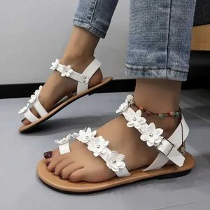 Sandálias femininas flores lisas planas de verão Novos chinelos de moda Banda de design trançada