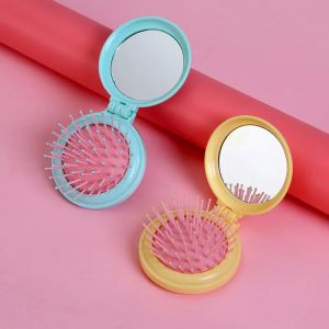 Mulheres portáteis bolso redondo bolso de massagem Pequena escova de cabelo com espelho Mini bolso espelho dobrável pente meninas ferramentas de estilo azul