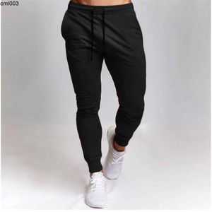 Gorące sprzedawane męskie spodnie sportowe swobodny stały kolor wszechstronny trening treningowy fitness