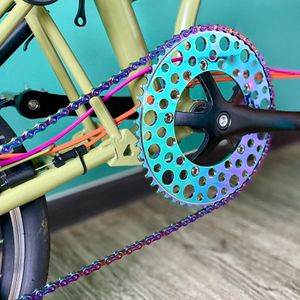 Bolany 130BCD BXM Folding Ultralight Bicycle Chaining Hollow Design Round Hole Plating Anode Rainbow 53T 56T Bike Chain Wheelwheel