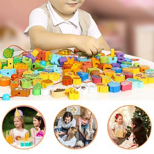 木製の教育モンテッソーリのスレッド学習おもちゃの3歳以上の幼児用幼児の幼稚園の活動