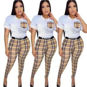 Kvinnors spårningsdräkter 2024 Autumn New Fashion Casual Stripe Checker Set Spliced ​​Pocket Designer Brand Women's Two Piece Set Q6099