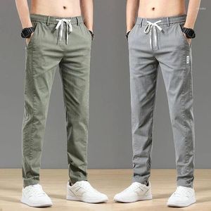 Calças masculinas Primavera Summer Summer Casual Moda fina de cintura elástica de estilo coreano