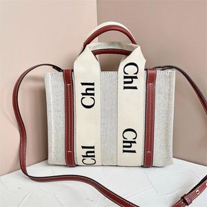 Högkapacitet Woody Tote Shopper väskor Luxurys handväska kvinnor sommar axel rese strand designer väskor mens duk koppling pochette mode crossbody blöja väska