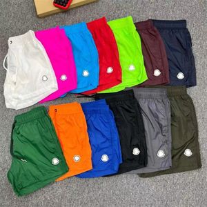 Pantaloni da spiaggia da uomo classico nuovo in stile estivo asciugatura rapida sport casual ricamato pantaloni versatili pantaloni medi slim fit a cinque parti pantaloni da spiaggia