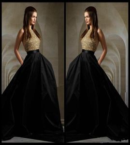 Vestidos de noite de elie saab 2016 lantejoulas de ouro deslumbrantes e saia preta Halter backless formal noite vestidos de trem varrem de baile3827392