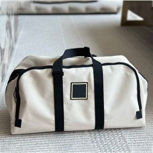 designer duffle bag Men women fashion designer travel bag Large capacity handbag Metal pendant canvas leather shoulder crossbody tote travel bag 240415