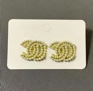 20k 18k oro oro lettere cristalline Orecchini designer di orecchini marca con borchie lunghe donne famose perle perle per le perle di compleanno gioielli per la festa di compleanno