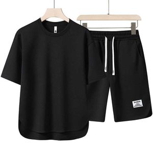 夏の卸売OEM Tシャツとショーツ特大のジョガーセット2ピースカスタムデザインクイックドライスポーツトラックスーツ男性用