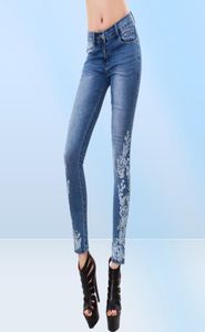 Nya mode jeans för kvinnor fjäril broderi blyertsbyxor mager byxor kvinnliga damer låg midja mode sommar denim byxor8122154