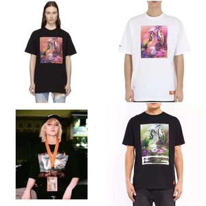 Mens T-Shirt En Çok Satan 2023 Yaz Heron Erkek Gevşek Tasarımcı Tarzı Kadın T-Shirt Alfabe Baskı Kısa Basın Kolları Lüks Hip Hop Giyim Sho