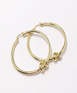 2021 BOA ANEL RINGS WOMENS Designer de jóias Brincos de ouro dos pregos hipoalergênicos um nó de cobre Eletroplating Fashion Part5434998