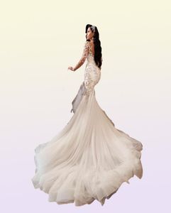 2022 Lyxig arabisk sjöjungfru bröllopsklänningar Dubai glittrande kristaller Långa ärmar Brudklänningar Court Train Tulle kjol Robes de Ma8798779