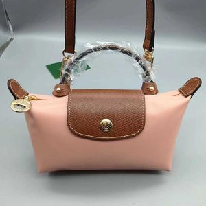 Le Pliage Unterschied Großhandel Bolsas Original perforiertes rosa Beutel Farbe Toiletten -Taschen Version des Gurtbrötchen