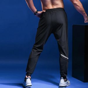 Spodnie 2020 mężczyzn Spodnie Spodnie Długie bieganie spodni fitness Gym Rajstopy Mężczyźni trening Spodnie Sporty Legginsy Szybkie suche spodnie do joggingu Mężczyźni