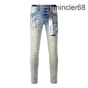 Purple branded jeans high street paint ripped holes distressed repairs low raised skinny denim trousers