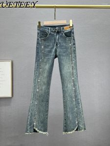 Kvinnors jeans delade denim bootcut byxor våren hög midja smal skummande europeiska varor strass klockbotten byxor