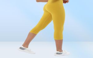 Capris Yoga Leggingsジムの服女性レギンスレギンスソリッドカラーハイウエストリフティングピーチヒップエクササイズアラインパンツタイツトレーニング7711510