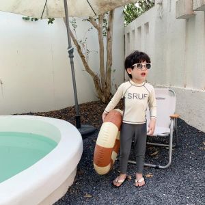 Pantaloni da bagno per bambini 2023 Nuovo costumi da bagno per bambini coreani Spacchi di pantaloni a maniche lunghe Set da bagno per ragazzi e ragazze