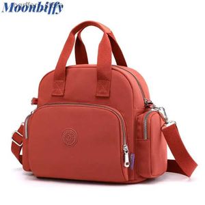 Bolsas de fraldas Manmite Mommy Mommy Mommy Bolsa para Nylon Backpack Bolsas femininas Multifuncional Pacotes de Maternidade Crossbody L410