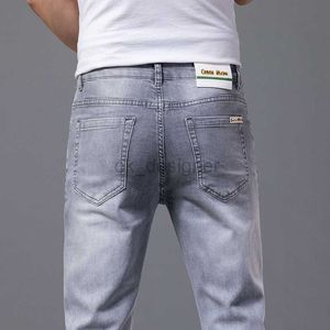 Mäns jeans designer avancerade sommar jeans mäns smala passform små fötter modemärke fritid elastiska våren och hösten new Men's Pants