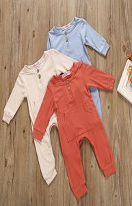 3 färger Nyfödda baby pojke flickor ficka rompers spädbarn fast färg långärmad bomull jumpsuits barnkläder M8943495675