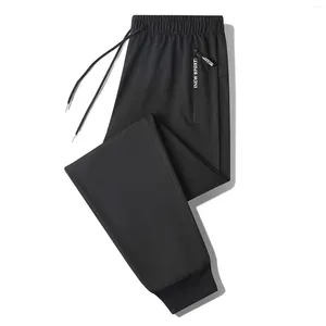 Calça masculina 6xl mulheres longas tamanho grande cintura elástica e elástica de moletom de corrida lápis diariamente use pisca de suor 2024 calças femininas