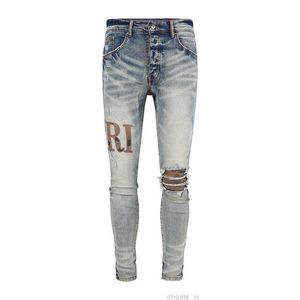 Mens Jeans Designer Классическая роскошная буква вышивка Emblem Fashion Slim Fit Perforated Elastic Jeans Motorcycle Men Pants