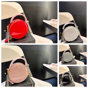 Triangle letter logo chain shoulder strap detachable handle can take patent leather round cake bag hand bill of lading shoulder crossbody female classic red.