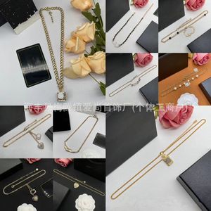 Pendant Necklaces 20 options for fashionable and trendy diamond studded pearl letter necklace as a Mother's Day gift