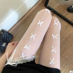 1x7s sexiga strumpor lolita bow knut fisknät strumpor kvinnor kryddig tjej svart vit sexig tunna insidvatten spetsar strumpbyxor gotiska ihåliga ut tights 240416