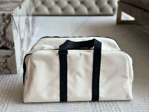 Duffel Bag Designer Reisetasche Fitnessbeutel Nylon Leinwand Einkaufstasche Handtasche Luxus -Taschen Umhängetasche große Kapazität Holdall Mann Frauen Gepäckbeutel Größe 50*26 cm