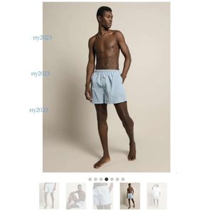 calça de calça de calça de grife de grife japonês de verão sólido shorts novos, esportes respiráveis Casal calças de secagem rápida masculino americano correndo calças cortadas finas