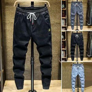 Мужские джинсы сплошной цветовой шнурки эластичная талия свободные грузовые брюки весна осенью корейский стиль лодыжка, привязанные гаремами, уличная одежда 240415