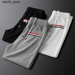 Calças masculinas Luxo de luxo de luxo calças casuais adequadas para homens primavera e verão confortável calça esportiva elástica respirável Q240417