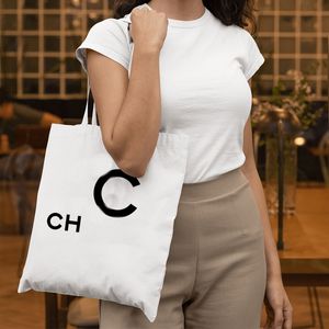 ホットデザイナーバッグ女性ハンドバッグキャンバスクロスボディショッピングファッションホワイトブラックハンドバッグ