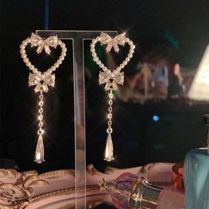 Kolczyki słodkie perły puste serce kroplowe dla kobiet dziewczęta moda bownot kryształ długi pendientes biżuteria 230831