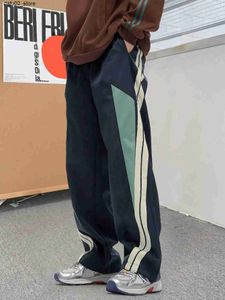 Spodnie męskie Kontrast kolor boczny Pasek Drukuj Druk String Batterants Streetwear Spodnie Mens Casual Wweatg Jogger Spring/Summer Q240417