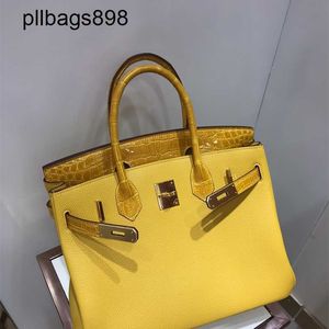 Madeira 7A Bolsa Bolsa Bikns Skin de couro genuíno barriga de crocodilo combinada com couro de 30 pacote de pacote portátil feminino feminino Luxo âmbar âmbar Yellowpjfd