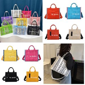 2024 Sommer Designer -Einkaufstaschen für Frauen Stoffe Säcke klare Mesh Tasche Sport Strand Handtaschen PVC Kapazität Geldbörse Einkaufsbodus Handtasche Canvas Weekender