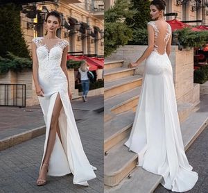 Elegnat Satin Cap Sleeves Mermaid Wedding Gowns Sheer Neck Lace Appliqued Garden Sweep Train Beach Bridal Dress Split Side Sexy Illusion Back Robes de Mariee CL0562