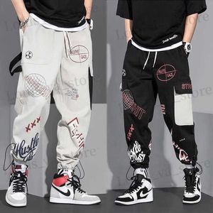 Męskie spodnie Męskie spodnie sprężyste i jesienne spodnie ładunkowe Man Fashion Hip Hop swobodne spodnie luźne koreańskie sznurka